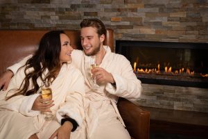 Couple by Fireplace